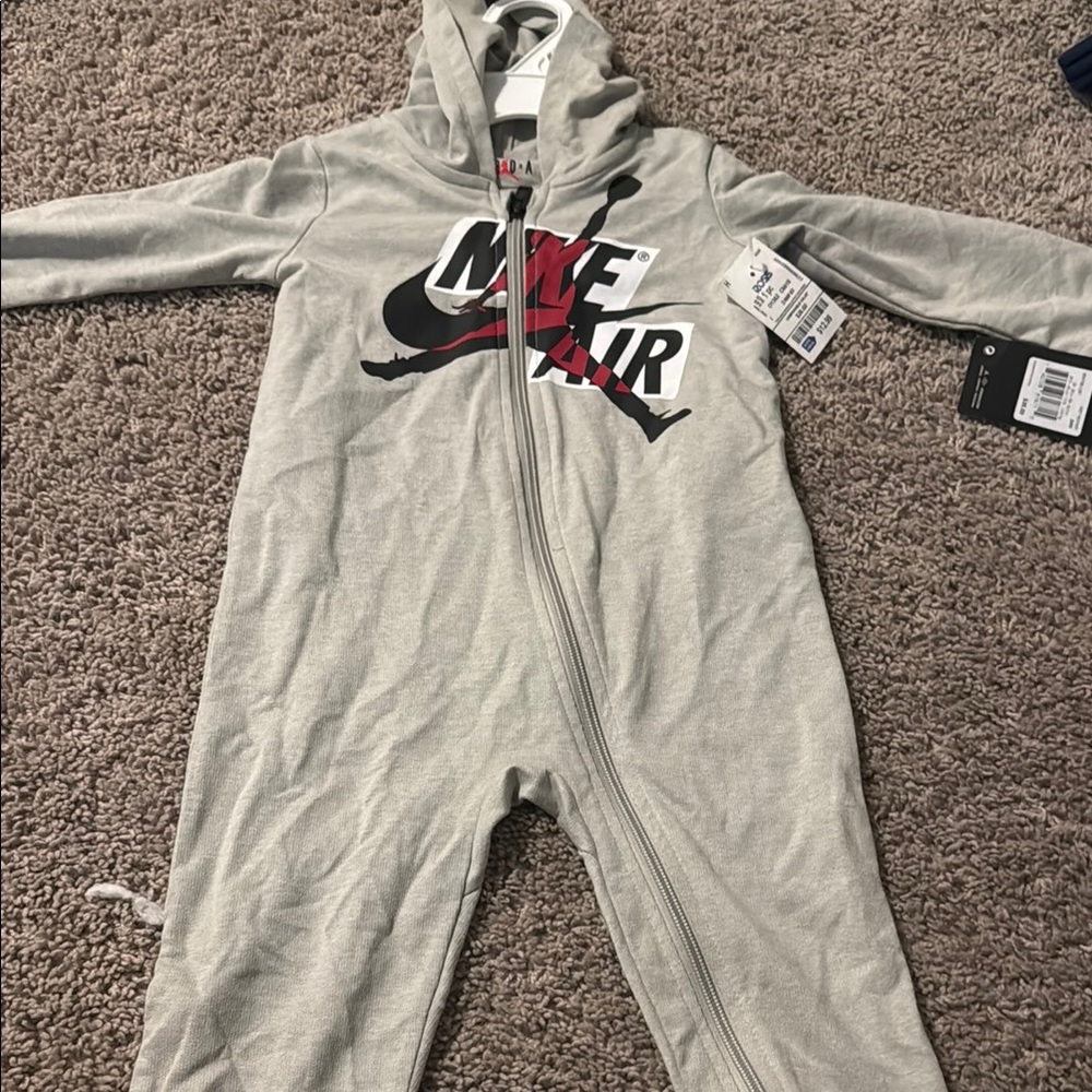 Nike Gray and Black Footies One Piece with Modern Design